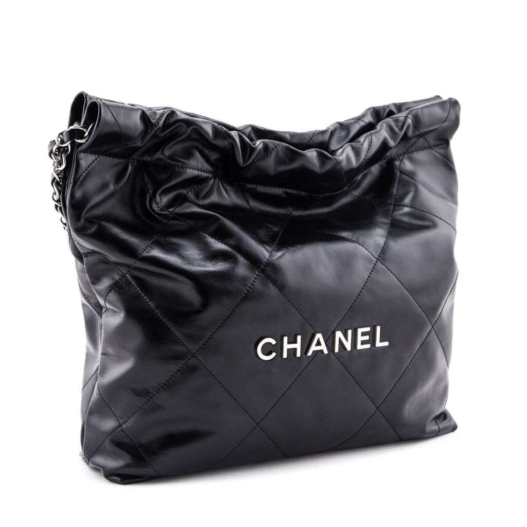 Chanel 22 handbag, Shiny calfskin & gold-tone metal , black — Fashion |  CHANEL